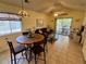 Living room with ceiling fan and sliding doors to balcony at 4430 Eastport Blvd. # L-11, Little River, SC 29566