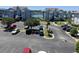 Expansive parking lot surrounded by lush landscaping and well-maintained condo buildings at 4430 Eastport Blvd. # L-11, Little River, SC 29566