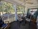 Relaxing screened porch featuring comfortable seating and scenic golf course views at 4430 Eastport Blvd. # L-11, Little River, SC 29566