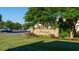Neighborhood entrance sign with stone base, flower bed, and lush, green lawn at 4430-G Montrose Ln. # G, Myrtle Beach, SC 29579