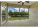 Relaxing screened lanai with ceiling fan and view of lush landscaping at 4430-G Montrose Ln. # G, Myrtle Beach, SC 29579