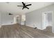Open-concept living room with neutral paint, modern ceiling fan, and light wood-look flooring at 4430-G Montrose Ln. # G, Myrtle Beach, SC 29579