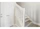 Interior staircase with white railing and Golf Bag Storage room at 4430-G Montrose Ln. # G, Myrtle Beach, SC 29579