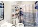 Cozy bathroom featuring a toilet with shelf, and a nautical-themed shower curtain at 4477 Little River Inn Ln. # 1802, Little River, SC 29566