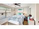 Charming bedroom with coastal decor, a ceiling fan, and natural light streaming through the window at 4477 Little River Inn Ln. # 1802, Little River, SC 29566