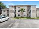Attractive condo building with parking area, stairs to upper levels and mature landscaping at 4477 Little River Inn Ln. # 1802, Little River, SC 29566