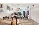 Open-concept living room with view of dining area, kitchen and neutral decor at 4477 Little River Inn Ln. # 1802, Little River, SC 29566