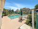 Outdoor community swimming pool surrounded by lounge chairs, tables, and landscaping at 4477 Little River Inn Ln. # 1802, Little River, SC 29566