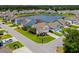 Aerial view of home with manicured lawn and pond access in a quiet neighborhood at 450 Oaklanding Ln., Murrells Inlet, SC 29576