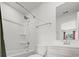 Clean bathroom with a shower-tub combo, white fixtures, and a vanity offering a practical and serene space at 450 Oaklanding Ln., Murrells Inlet, SC 29576