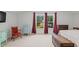 Bright bedroom featuring large windows with red curtains, neutral carpet and paint, and ample natural light at 450 Oaklanding Ln., Murrells Inlet, SC 29576