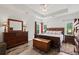 This is a bedroom with hardwood floors, dresser, windows, wooden chest and an area rug at 450 Oaklanding Ln., Murrells Inlet, SC 29576