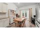 Bright eat-in kitchen with light wood table, sliding glass doors and ample cabinet space at 450 Oaklanding Ln., Murrells Inlet, SC 29576