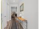 Bright hallway with wood floors, elegant decor, and a view into the living area at 450 Oaklanding Ln., Murrells Inlet, SC 29576