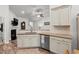 Bright kitchen with granite countertops, stainless steel dishwasher and tile backsplash at 450 Oaklanding Ln., Murrells Inlet, SC 29576