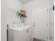 Laundry room with washer and dryer, wire shelving and access to the exterior of the home at 450 Oaklanding Ln., Murrells Inlet, SC 29576
