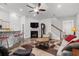 Inviting living room featuring hardwood floors, a fireplace, and modern furniture at 450 Oaklanding Ln., Murrells Inlet, SC 29576