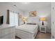 Cozy main bedroom with neutral colors, a comfortable bed, and stylish nightstands at 450 Oaklanding Ln., Murrells Inlet, SC 29576