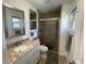 Beautifully renovated bathroom with a tiled walk-in shower, modern vanity, and stylish fixtures at 4637 Dogwood St., Loris, SC 29569