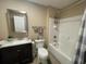 Clean bathroom featuring a shower-tub combo, vanity with sink, and neutral color scheme at 4637 Dogwood St., Loris, SC 29569