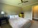 Cozy bedroom with a bed, side tables, and a ceiling fan for added comfort at 4637 Dogwood St., Loris, SC 29569