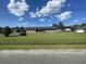 Charming brick ranch with inviting covered porch and large well-maintained front lawn at 4637 Dogwood St., Loris, SC 29569