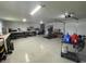 Spacious garage with epoxy floor, storage, workbench and overhead lighting at 4637 Dogwood St., Loris, SC 29569