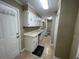 Functional laundry room with ample cabinet storage, countertop space, and a neutral color scheme at 4637 Dogwood St., Loris, SC 29569
