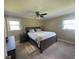 Comfortable bedroom featuring a spacious bed, hardwood floors, and a calm, neutral color palette at 4637 Dogwood St., Loris, SC 29569
