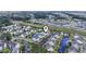 Aerial view of condo buildings, lakes, and residential community, with locator pin at 4924 Pond Shoals Ct. # 201, Myrtle Beach, SC 29579