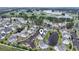 Aerial view of condos, ponds, and a golf course in a residential community, with locator pin at 4924 Pond Shoals Ct. # 201, Myrtle Beach, SC 29579