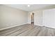 Neutral bedroom with plank floors, a closet and an doorway to a bathroom at 4924 Pond Shoals Ct. # 201, Myrtle Beach, SC 29579