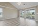 Spacious bedroom featuring high ceilings, light wood flooring, and sliding doors at 4924 Pond Shoals Ct. # 201, Myrtle Beach, SC 29579