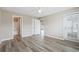 A bright bedroom with plank flooring, ceiling fan and access to an outdoor area at 4924 Pond Shoals Ct. # 201, Myrtle Beach, SC 29579