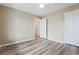 Bedroom with ceiling fan, neutral walls, laminate flooring and view to hallway and doorways at 4924 Pond Shoals Ct. # 201, Myrtle Beach, SC 29579