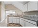Bright kitchen featuring white cabinets, granite countertops, and modern appliances at 4924 Pond Shoals Ct. # 201, Myrtle Beach, SC 29579