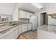 Kitchen with granite countertops, white cabinets, and stainless steel sink at 4924 Pond Shoals Ct. # 201, Myrtle Beach, SC 29579