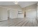 Open-concept living room featuring high ceilings and light wood flooring at 4924 Pond Shoals Ct. # 201, Myrtle Beach, SC 29579