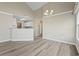 Bright living room showcases light wood floors and neutral tones with a view into the kitchen at 4924 Pond Shoals Ct. # 201, Myrtle Beach, SC 29579