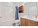 Bathroom with shower-over-tub, dark wood vanity, and updated finishes at 50 Turning Stone Blvd. # 7, Murrells Inlet, SC 29576