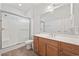 Bright bathroom features wood-look floors, shower over tub, and large vanity at 50 Turning Stone Blvd. # 7, Murrells Inlet, SC 29576