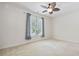 Comfortable bedroom with neutral carpeting, a ceiling fan, and a window with natural light at 50 Turning Stone Blvd. # 7, Murrells Inlet, SC 29576