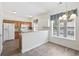 Bright kitchen with wooden cabinets, tile backsplash, white appliances, and a dining area at 50 Turning Stone Blvd. # 7, Murrells Inlet, SC 29576