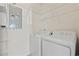 Convenient laundry area equipped with a washer, dryer, and shelving for storage at 50 Turning Stone Blvd. # 7, Murrells Inlet, SC 29576