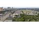 An aerial view highlights a property with vast parking, nearby shops, and easy access to a vibrant commercial district at 505 28Th Ave. N, Myrtle Beach, SC 29577