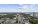 An aerial view displays a property near the beach with commercial and residential development surrounded by lush trees at 505 28Th Ave. N, Myrtle Beach, SC 29577
