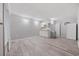 This gray living room features modern wood-look floors and a compact kitchen area at 505 28Th Ave. N, Myrtle Beach, SC 29577