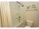 Clean bathroom featuring a shower and tub with white fixtures and coastal-themed decor at 5059 Sundrop Ln., Little River, SC 29566