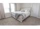 Cozy bedroom featuring a queen bed, soft carpet, and ample natural light, perfect for relaxation at 5059 Sundrop Ln., Little River, SC 29566