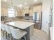 Modern kitchen with island seating, stainless steel appliances, and stylish cabinets; perfect for entertaining at 5059 Sundrop Ln., Little River, SC 29566